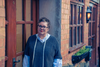 Jules standing in the doorway of her new studio