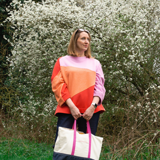 female standing wearing the origami sweatshirt sewing pattern